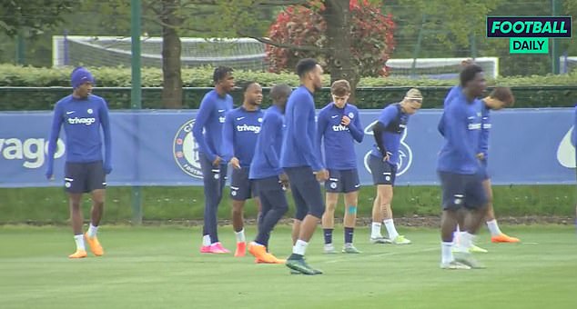 He could be seen standing alongside £88million signing Mykhailo Mudryk (third from right)