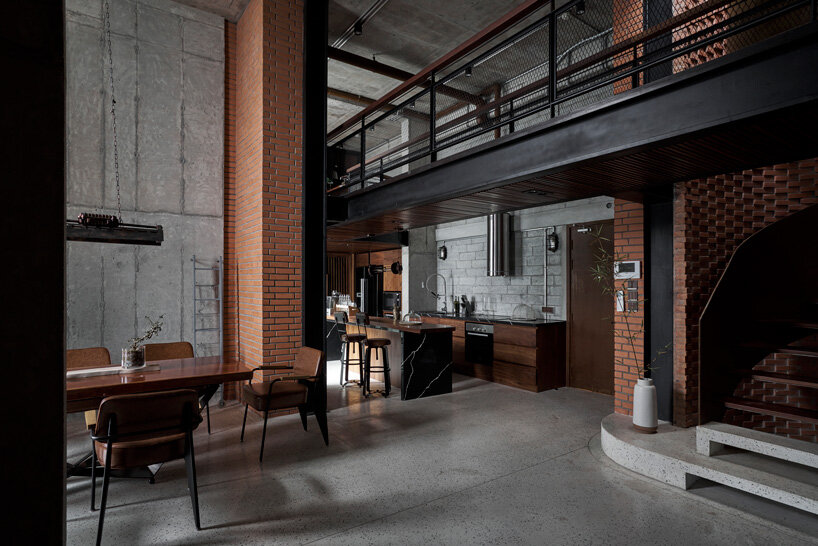 le house renovates penthouse in vietnam with brick, concrete + industrial aesthetics